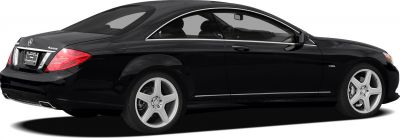 Black luxury coupe side view with 5-spoke alloy wheels and chrome trim