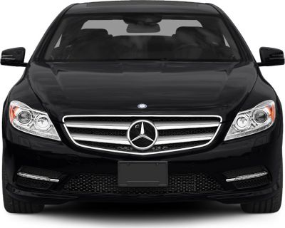 Front view of luxury coupe with iconic grille and headlights