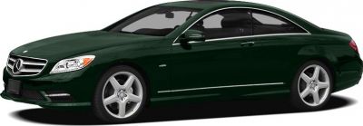 Side profile of luxury coupe with alloy wheels in dark green.