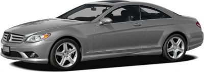 Side profile of sleek silver luxury coupe with alloy wheels