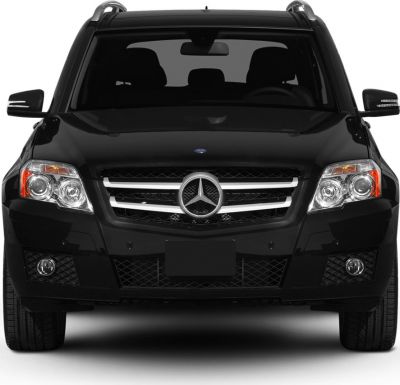 Front profile showing headlights, grille, and sleek design of a black SUV