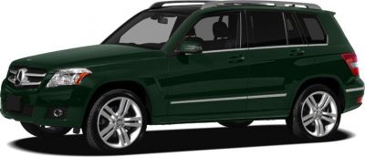 Side and front profile of dark green SUV with alloy wheels and roof rails