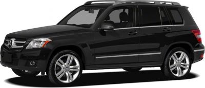 Side view of black SUV with alloy wheels and roof rails