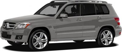 Front side view of a grey SUV with prominent grille and alloy wheels