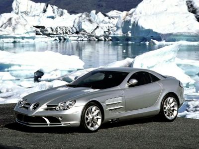 Silver sports coupe with aerodynamic front side design and alloy wheels