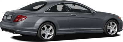 Sleek rear side view of a modern two-door coupe with alloy wheels