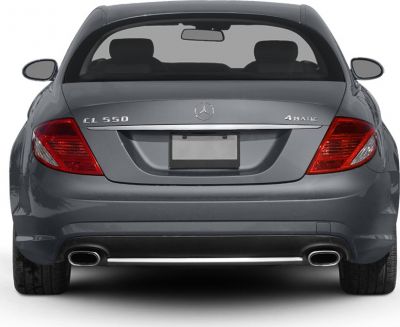 Rear view featuring tail lights, badges, and dual exhaust pipes