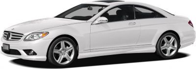 White luxury two-door coupe with aerodynamic design and alloy wheels