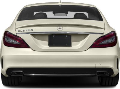 Rear view with tail lights, dual exhausts, rear spoiler of a luxury coupe