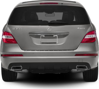 Rear view with taillights, rear window, badges, and dual exhausts