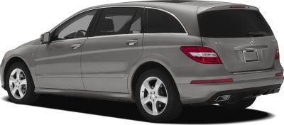 Rear-side view of elongated luxury SUV with tail lights