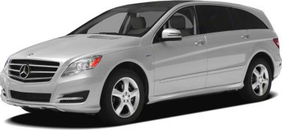 Front side view of silver luxury MPV with 5-spoke wheels