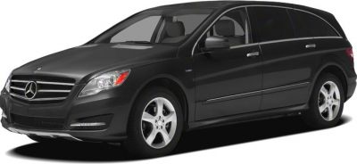 Front side view of a sleek vehicle with distinctive grille and alloy wheels