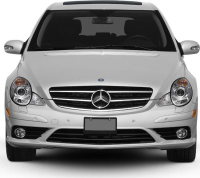 Close-up front view with headlights, grille, and emblem
