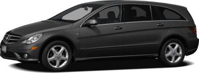 Side profile of elongated luxury vehicle with alloy wheels, sleek body.