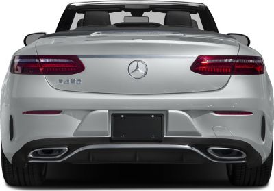 Rear view showing stylish tail lights and dual exhaust of a convertible.