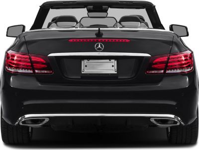Rear view of convertible with distinct taillights and dual exhausts