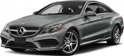 Front side view of coupe with grille and alloy wheels