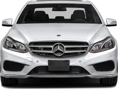 Front view displaying grille and headlights of luxury sedan