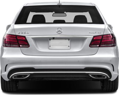 Rear rear with Bluetec badge and dual exhaust tips, taillights illuminated