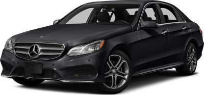 Front side of luxury sedan with distinct grille and multi-spoke alloy wheels