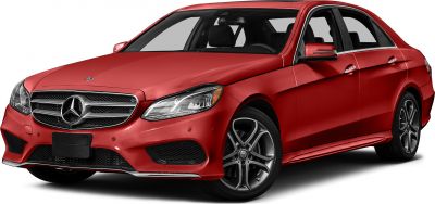 Red sedan with modern front grille and alloy wheels