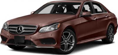 Front view of sleek sedan with prominent grille and alloy wheels