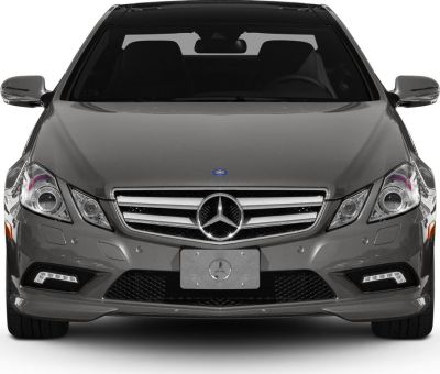 Front profile showing prominent grille and LED daytime running lights