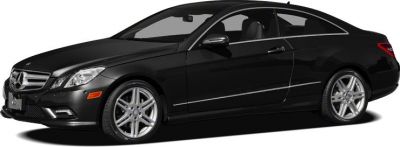 Black two-door coupe with alloy wheels and LED daytime running lights
