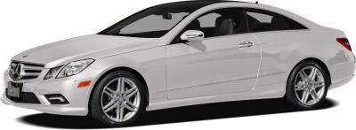 White two-door luxury coupe with alloy wheels and aerodynamic design
