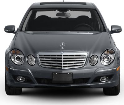 Front view with grille, round headlights, and fog lamps
