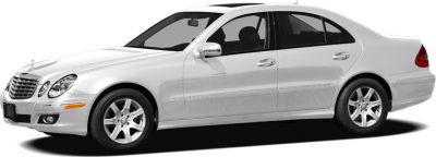 Side view of a white mid-size sedan with alloy wheels and four doors