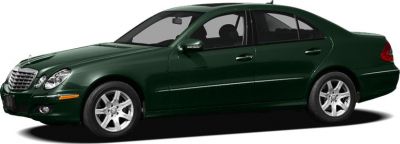Side profile of a dark green luxury sedan with alloy wheels