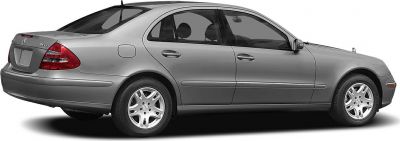 Silver four-door sedan with classic wheel rims