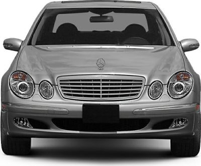 Front view with grille and quad round headlights