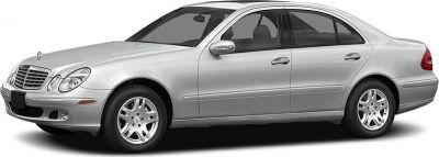 Silver luxury sedan with oval dual headlights and alloy wheels