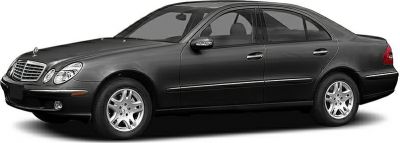 Side view of black four-door sedan with alloy wheels