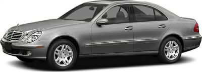 Silver midsize luxury sedan with alloy wheels side profile
