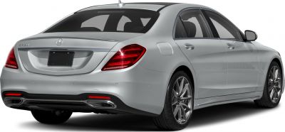 Rear view of luxury sedan with distinctive taillights and dual exhaust