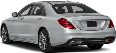 Rear view of luxury sedan with sleek taillights and dual exhausts
