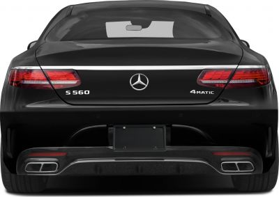 Rear view with S 560 and 4MATIC badges, LED tail lights, and quad exhaust tips.