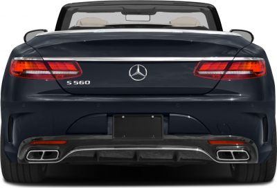 Rear view of luxury convertible with LED taillights and quad exhaust