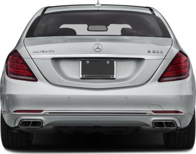 Luxury sedan rear with quad exhaust and sleek taillights