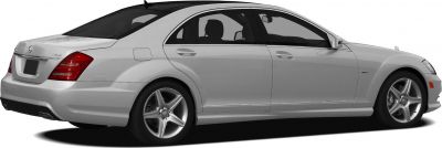 Rear-side view of luxury sedan with alloy wheels and hybrid badge