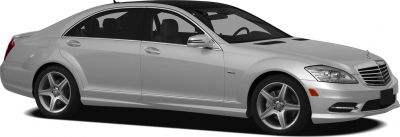 Side profile of silver luxury sedan with alloy wheels