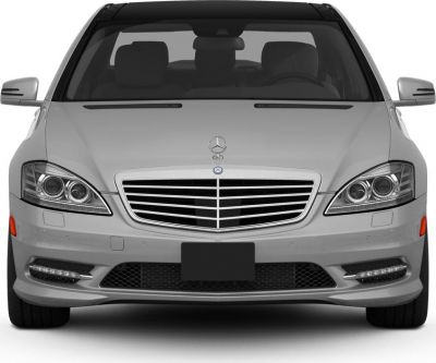 Close-up front of luxury sedan grille and headlights.