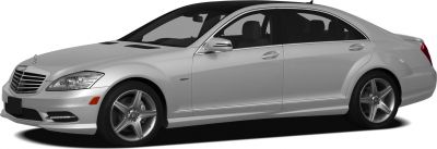 Silver mid-size luxury sedan with AMG wheels and LED daytime running lights