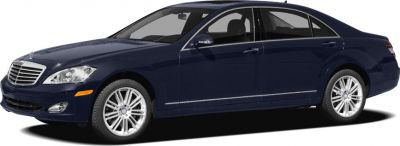 Luxury sedan side profile with chrome trim and multi-spoke alloy wheels