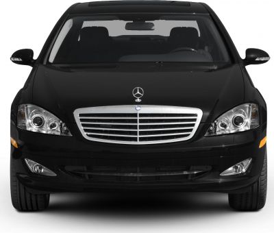 Front view with chrome grille and dual round headlights