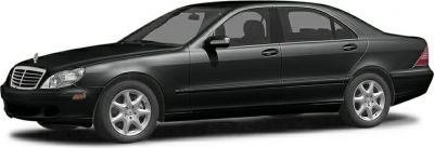 Side profile of a black luxury sedan with alloy wheels and four doors